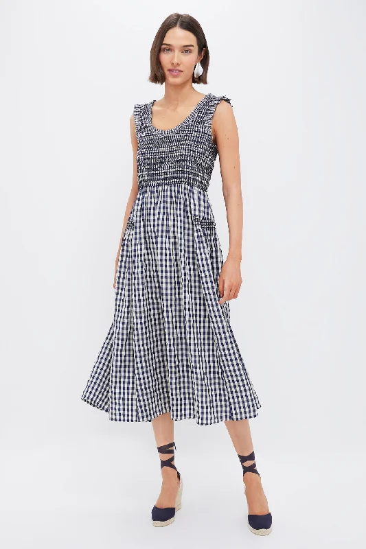 Midi dresses with tiered skirts for a bohemian festival look Navy Gingham Smocked Abilene Midi Dress Midi dresses with tiered skirts for a bohemian festival look Navy Gingham Smocked Abilene Midi Dress