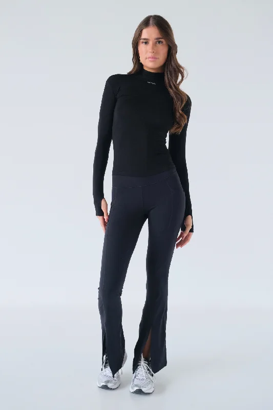 Plus Size Women's Sheer Tight Trousers in Nude for a Subtle and Stylish StatementSplit Flare Pocket Leggings - Black Plus Size Women's Sheer Tight Trousers in Nude for a Subtle and Stylish StatementSplit Flare Pocket Leggings - Black