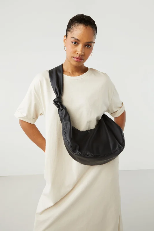 hand knitted women cardigan with artisanal charmKNOTTED SLING BAG