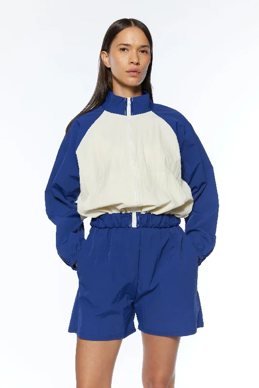 cable knit women cardigan with intricate patternsWINDBREAK HALF ZIP AND SHORT SET