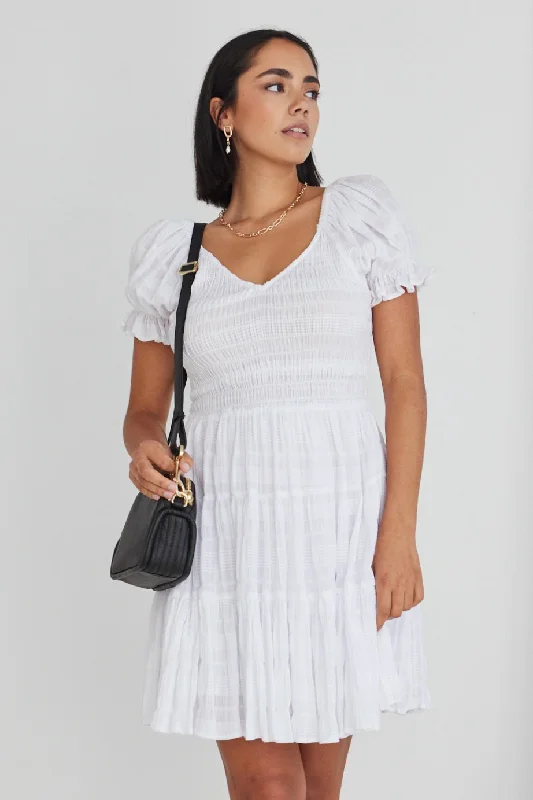 Ruffled Women Dress with Multiple Layers for a Playful and Girly StyleHeidi White Shirred Cotton SS V Neck Shirred Bodice Mini Dress Ruffled Women Dress with Multiple Layers for a Playful and Girly StyleHeidi White Shirred Cotton SS V Neck Shirred Bodice Mini Dress