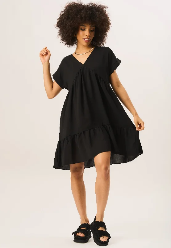 Mini dresses with bow accents for a sweet lookBlack V Neck Tiered Mini Smock Dress
