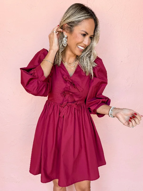 Mini dresses with ruched bodices for a feminine touchJust A Girl Bow Mini Dress-Garnet Mini dresses with ruched bodices for a feminine touchJust A Girl Bow Mini Dress-Garnet